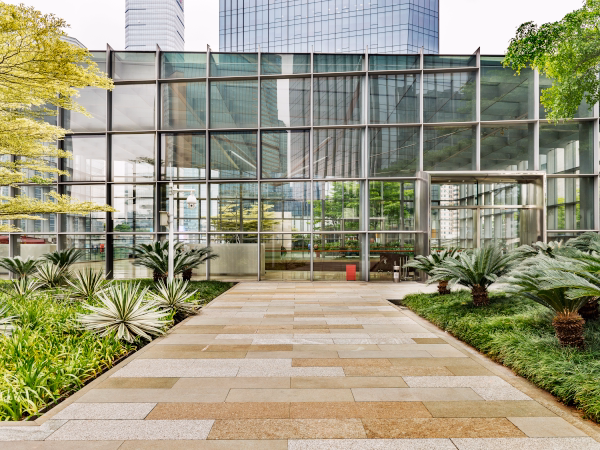 Commercial property entrance with manicured landscaping