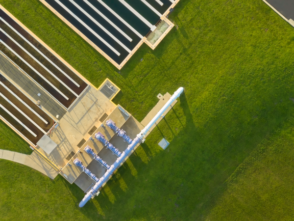 Aerial view of industrial facility grounds with surrounding lawn